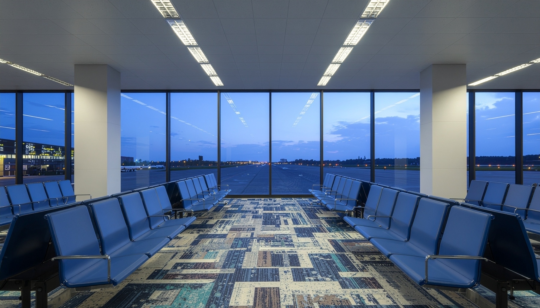empty-airport-gate-area-at-3am-rows-of-blue-seats